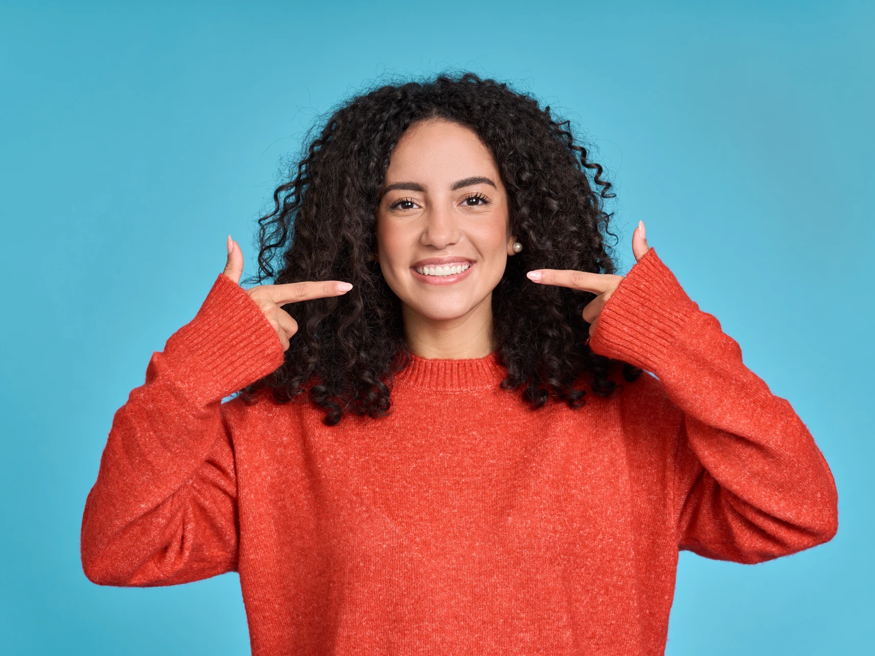 Young woman smiling after teeth cleaning